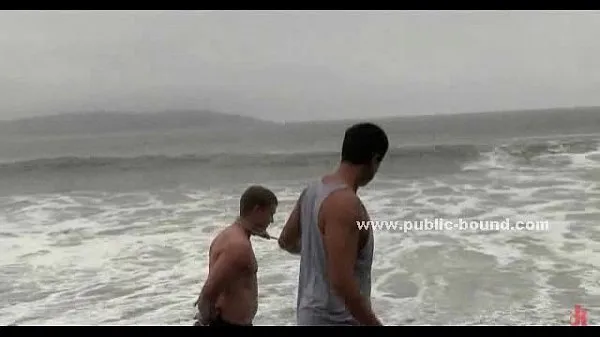 Young gay twink bound in ropes on beach novos clipes interessantes